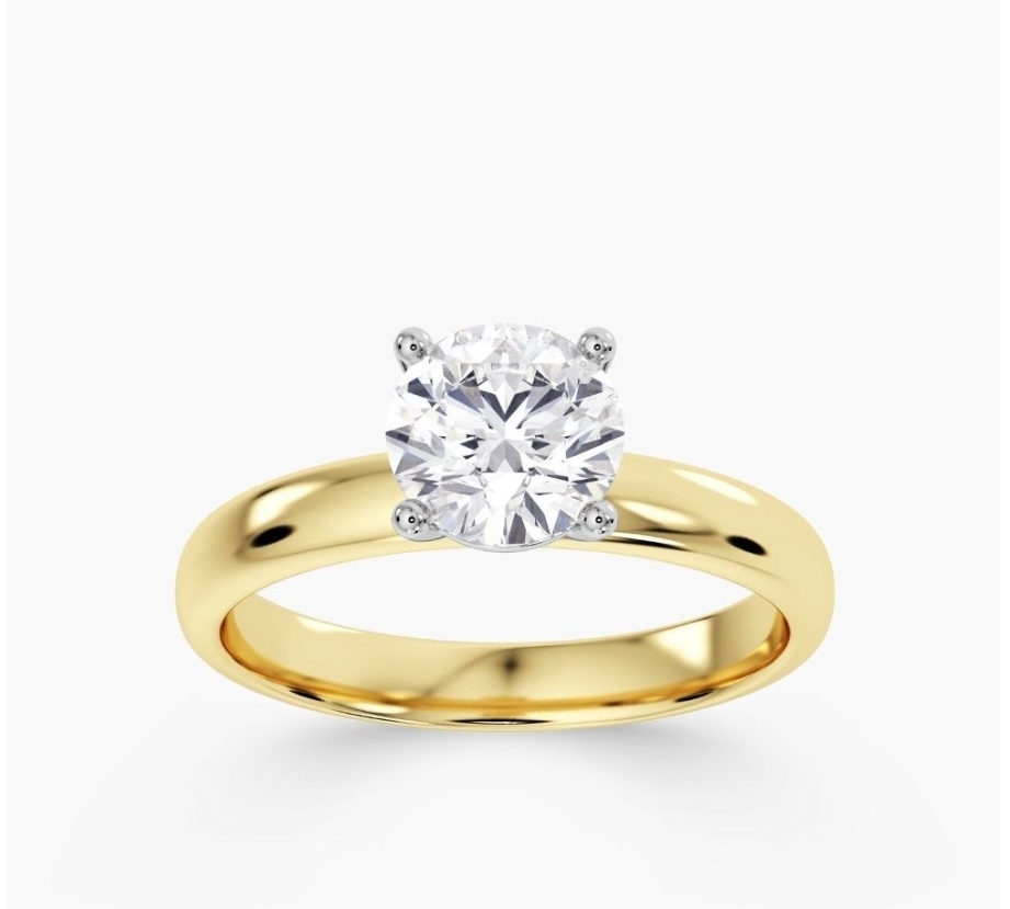 Round diamond on a thick yellow gold band.